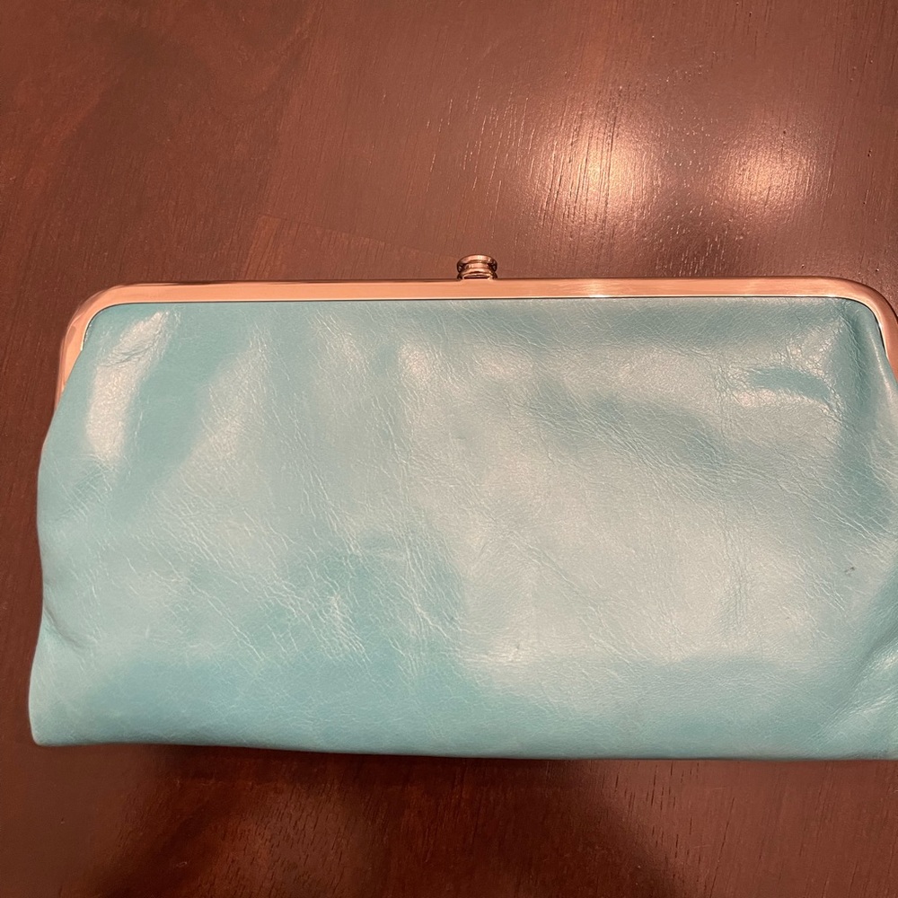 Hobo Lauren Wallet; light aqua; never used; small scratch on corner metal frame